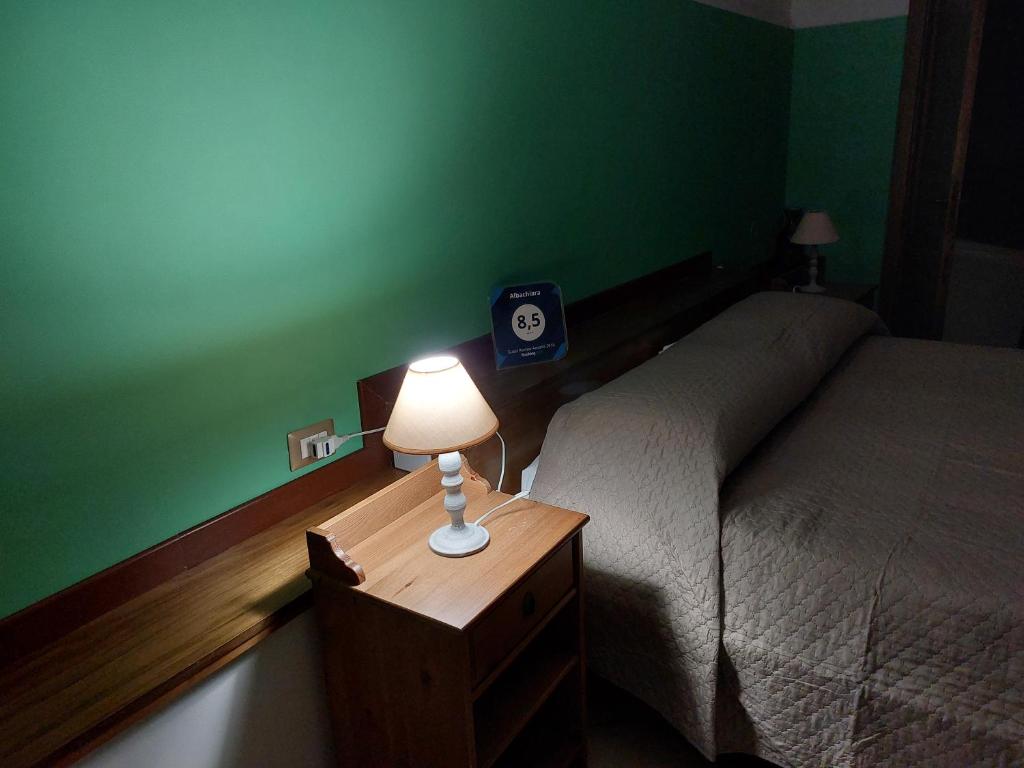 Postel nebo postele na pokoji v ubytování B&B Albachiara