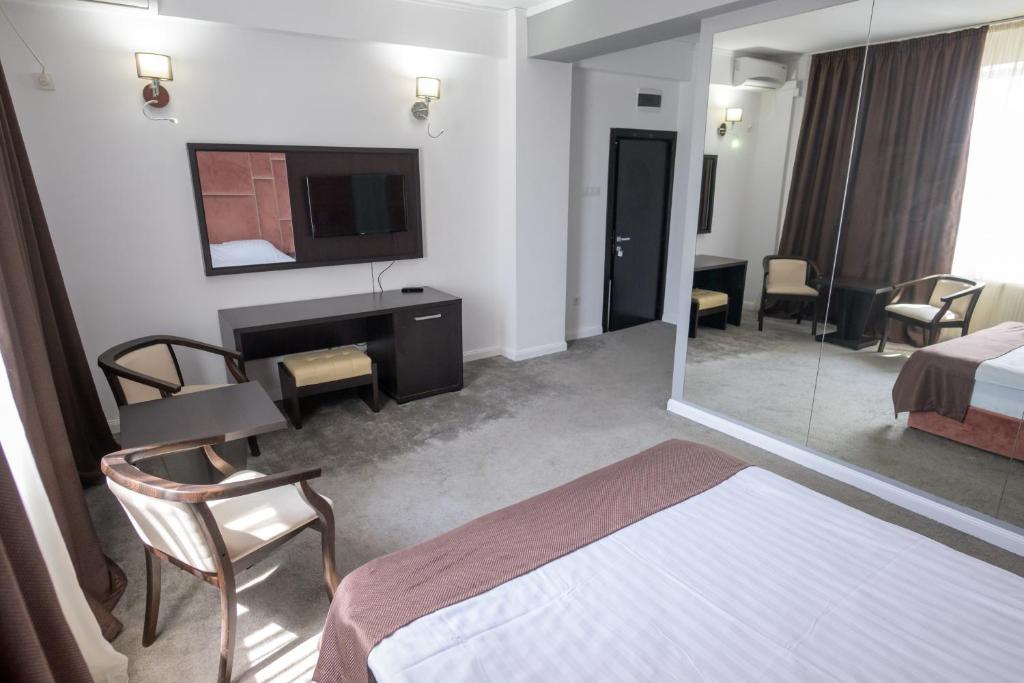 Postel nebo postele na pokoji v ubytování Hotel Maryiotis