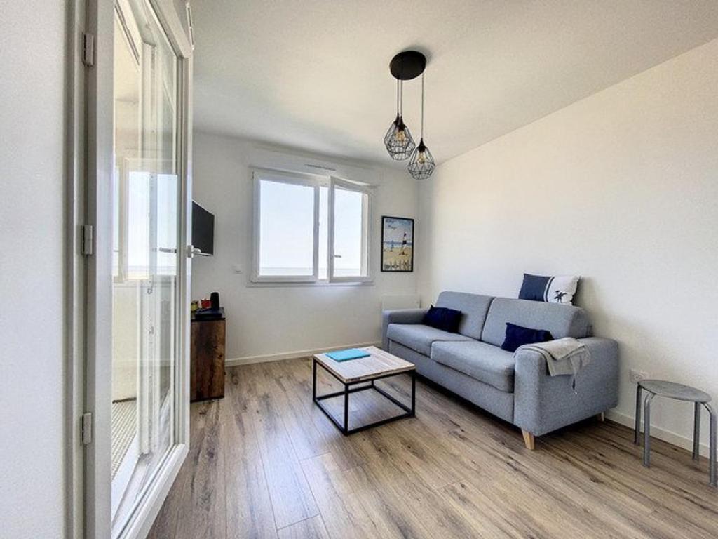 Część wypoczynkowa w obiekcie Appartement face mer pour 4 pers, déco soignée, balcon, garage, animaux acceptés - FR-1-236-155