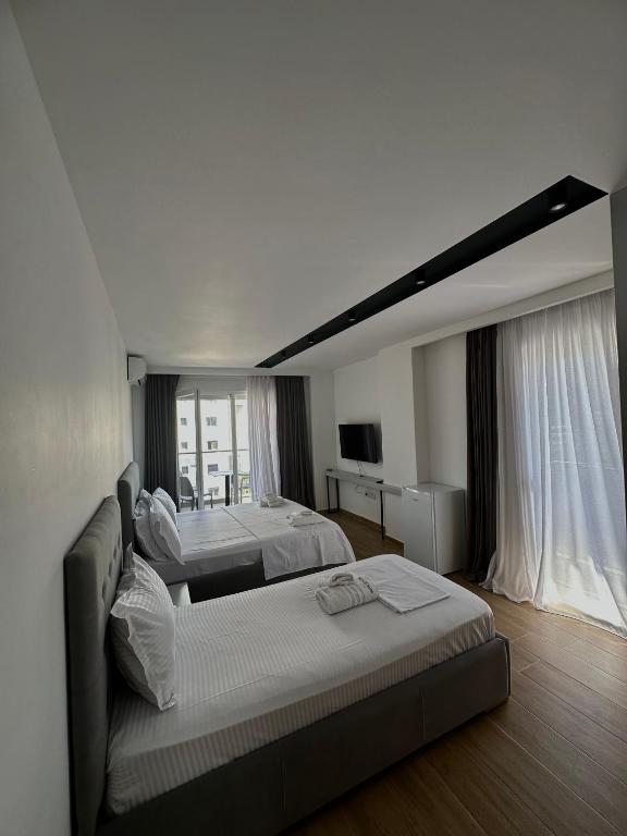 Postel nebo postele na pokoji v ubytování Suite Hotel