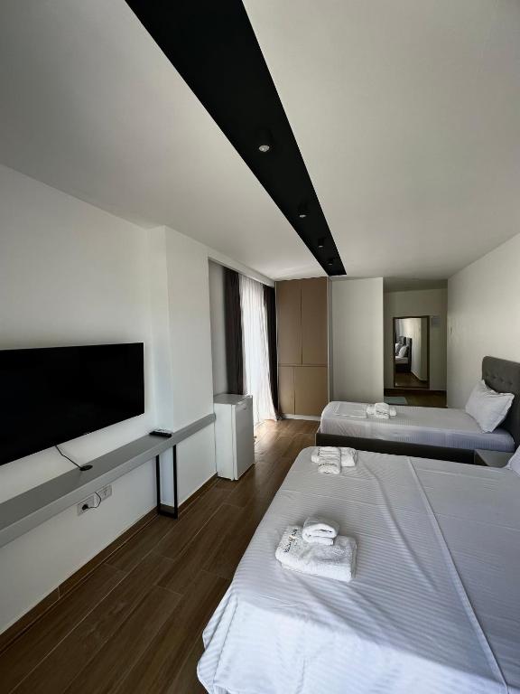 Postel nebo postele na pokoji v ubytování Suite Hotel