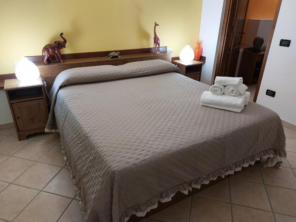 Postel nebo postele na pokoji v ubytování B&B Albachiara