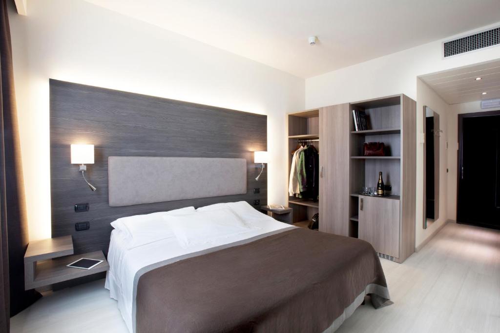 Una cama o camas en una habitación de Hotel Giardino