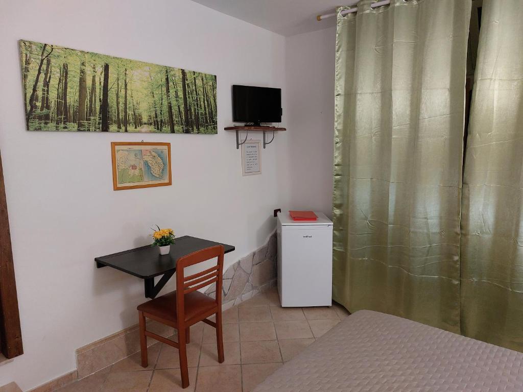 TV a/nebo společenská místnost v ubytování B&B Albachiara