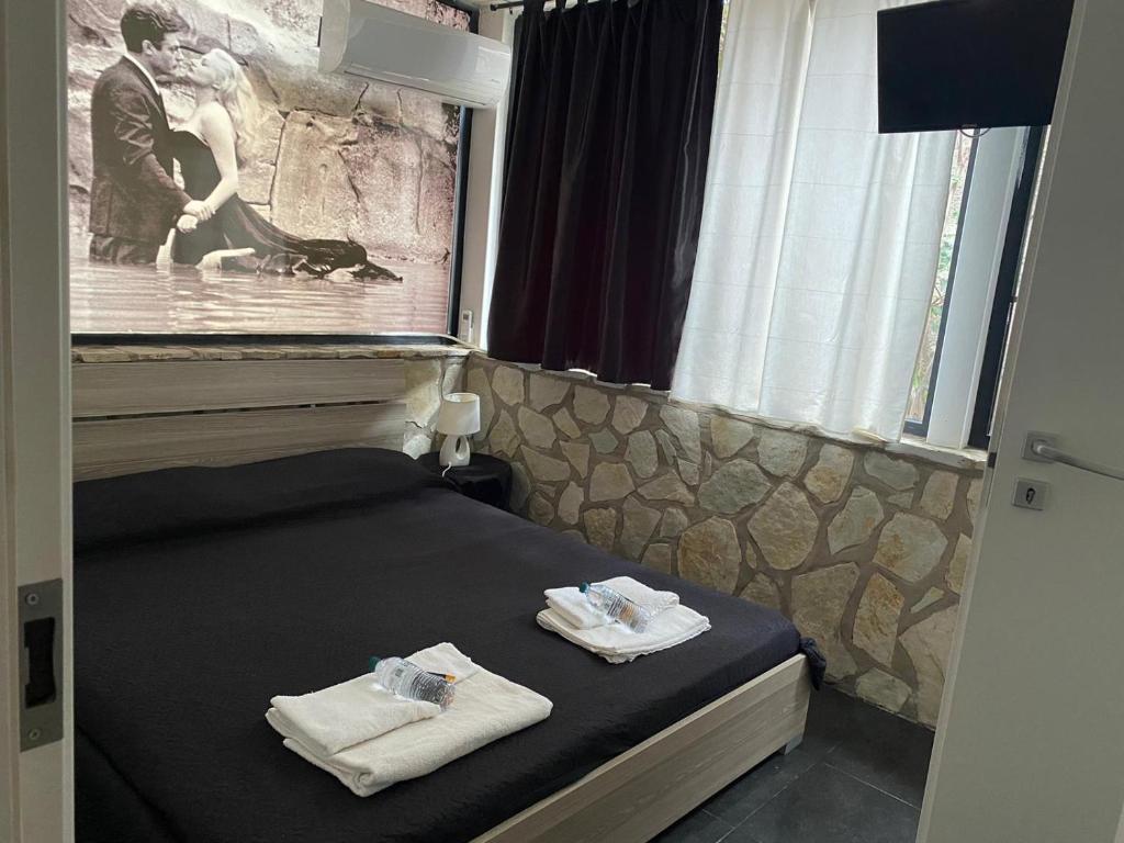 Ένα ή περισσότερα κρεβάτια σε δωμάτιο στο Dolce Vita casa vacanze