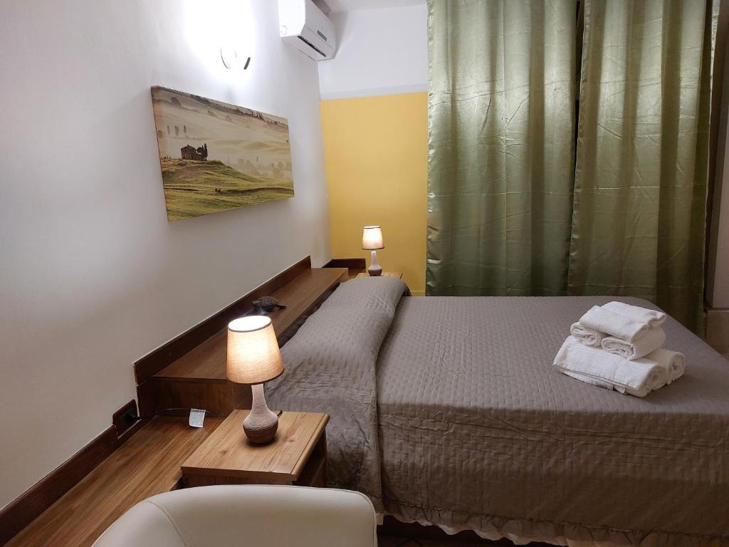 Postel nebo postele na pokoji v ubytování B&B Albachiara
