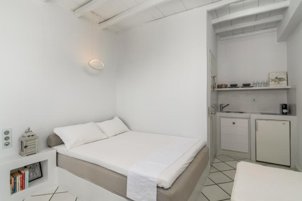 A bed or beds in a room at Archondoula Studios