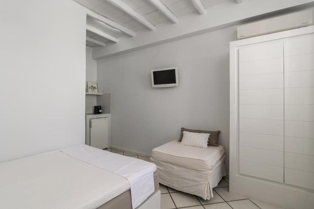 A bed or beds in a room at Archondoula Studios