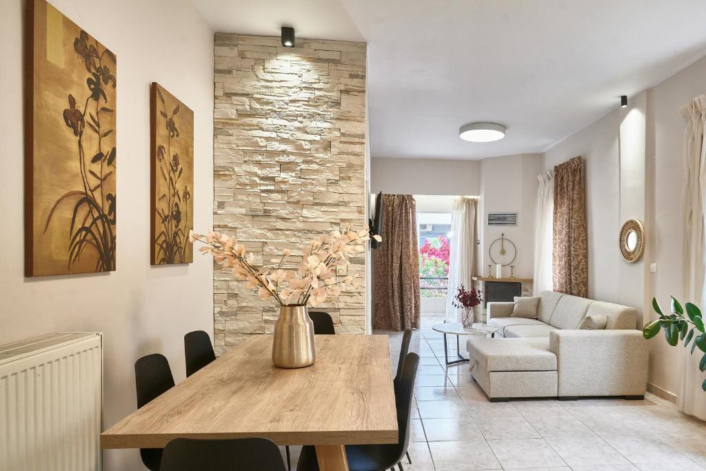a living room with a table and a couch at Luxurious house near the sea in Kato Daratso