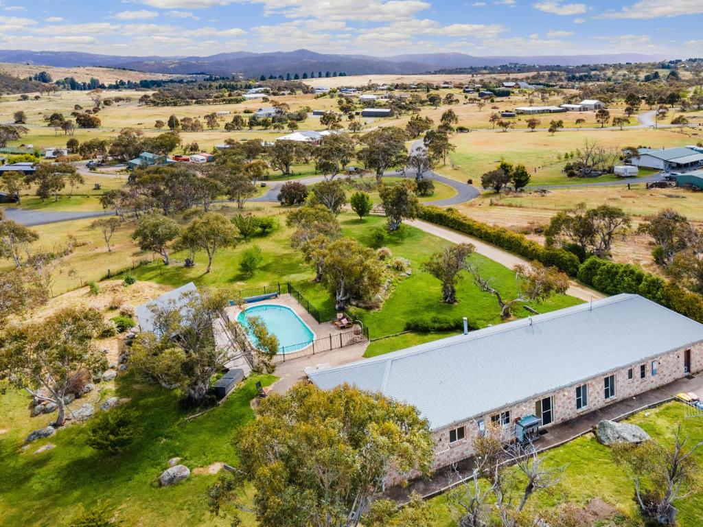 an aerial view of a large building with a yard at Winterwood Lodge Farm Stay- 6mins Jindabyne Pets Allow Floor Heating in Moonbah