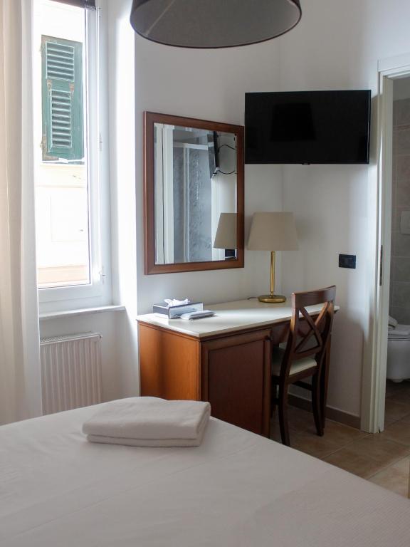 Posteľ alebo postele v izbe v ubytovaní La Camogliese Hotel B&B
