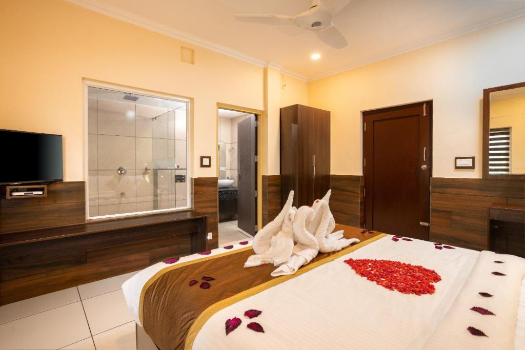 Postel nebo postele na pokoji v ubytování Star Emirates Luxury Resort and Spa, Munnar