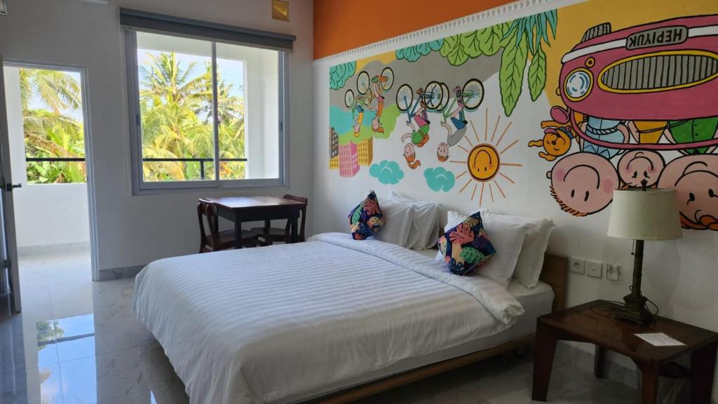 Postel nebo postele na pokoji v ubytování Hepi Yuk Ubud Luxury Guesthouse