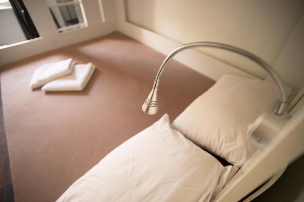 Postel nebo postele na pokoji v ubytování All in Hostel