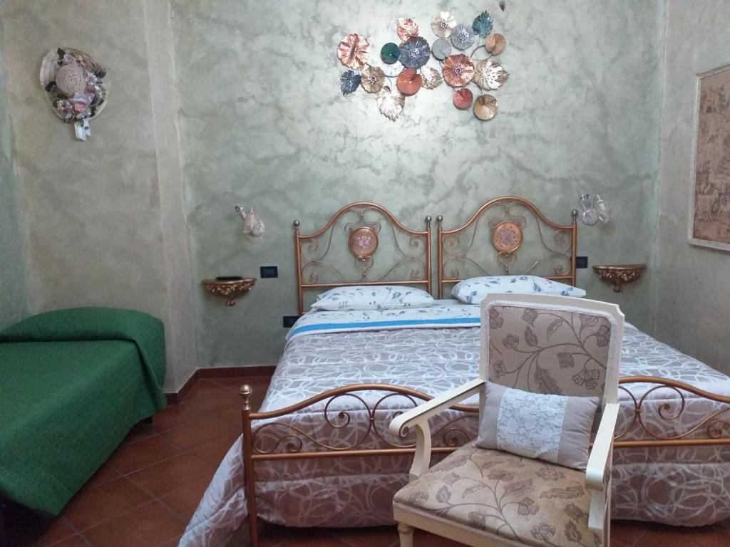 Ένα ή περισσότερα κρεβάτια σε δωμάτιο στο La Mammola Bed&Breakfast