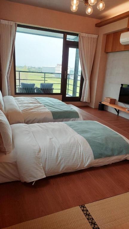 Postel nebo postele na pokoji v ubytování Jiaoxi Pusu Homestay