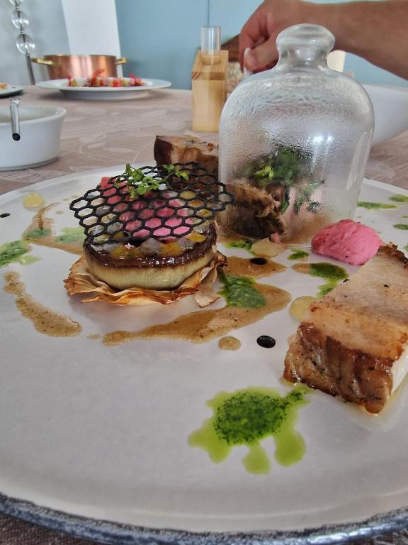 a plate of food on a table with food on it at Fantinello Hotel in Caorle