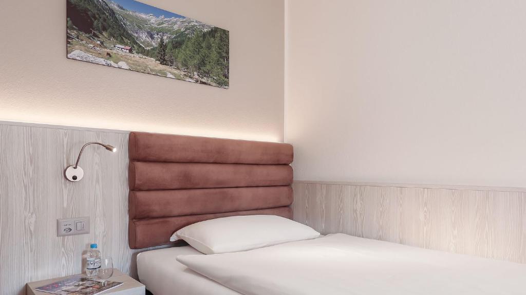 Postel nebo postele na pokoji v ubytování Hotel La Perla