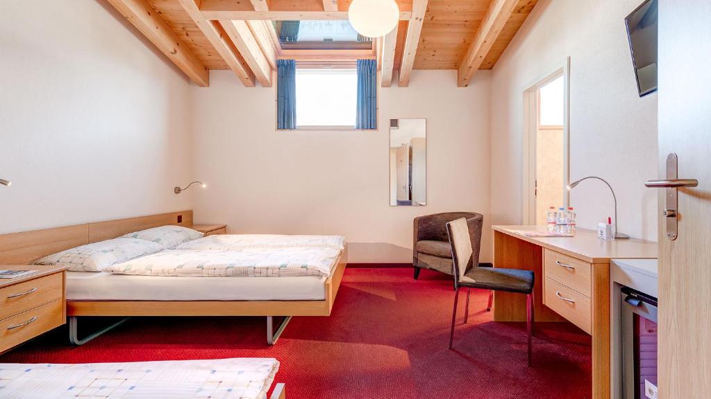 Postel nebo postele na pokoji v ubytování Hotel La Perla