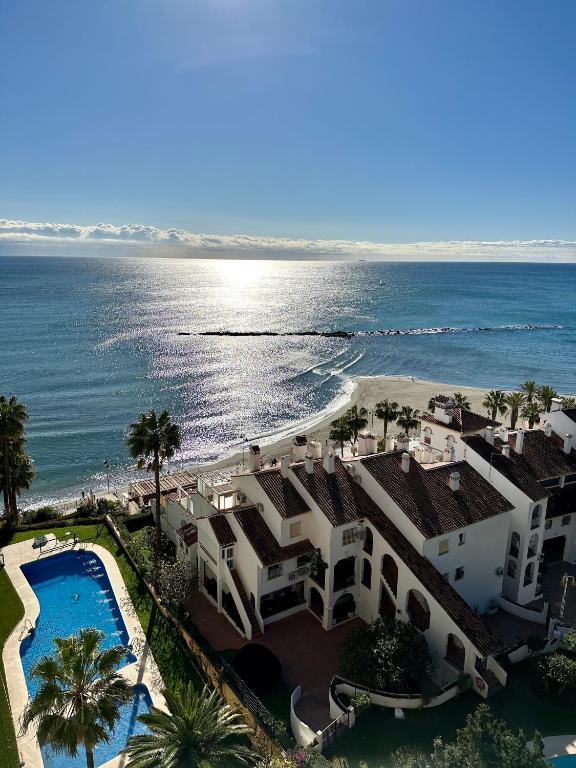 an aerial view of a house and the ocean at TOP Benalmadena in Benalmádena