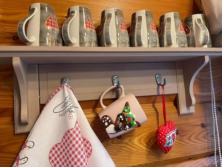 a shelf with christmas ornaments on it at Domki na Górniej Łące - Domek Górny in Łazany