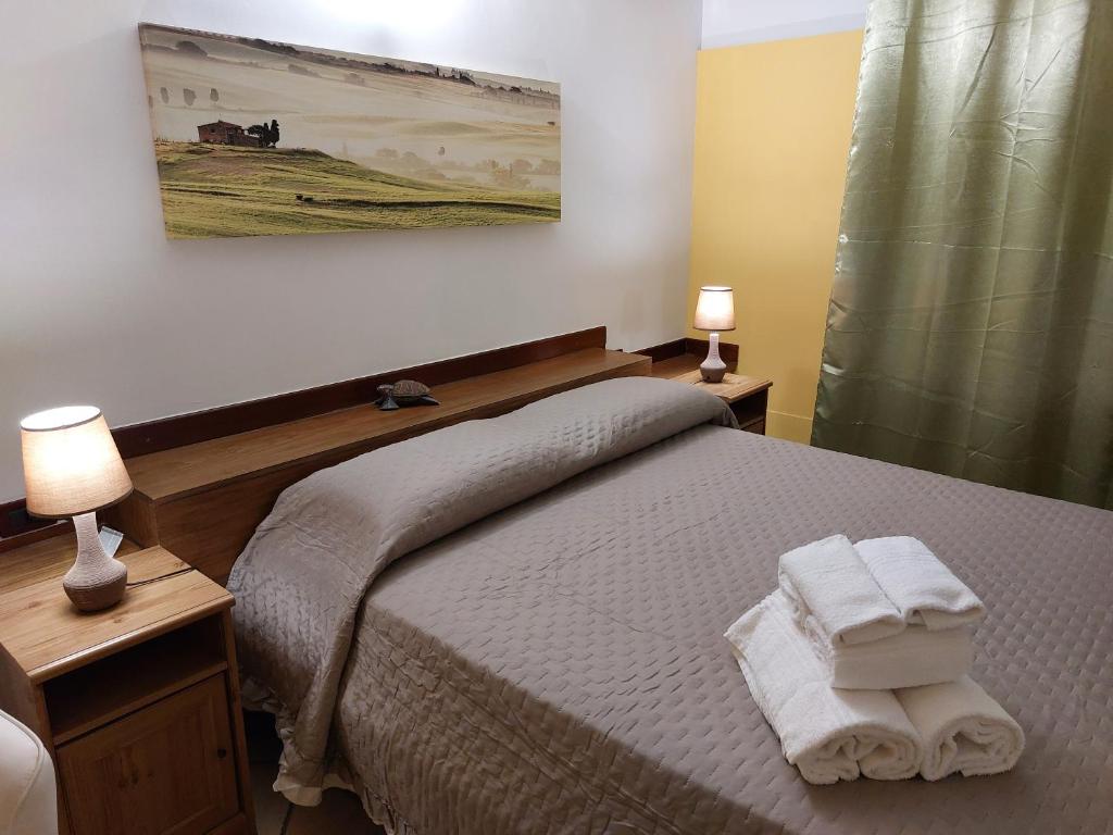 Postel nebo postele na pokoji v ubytování B&B Albachiara
