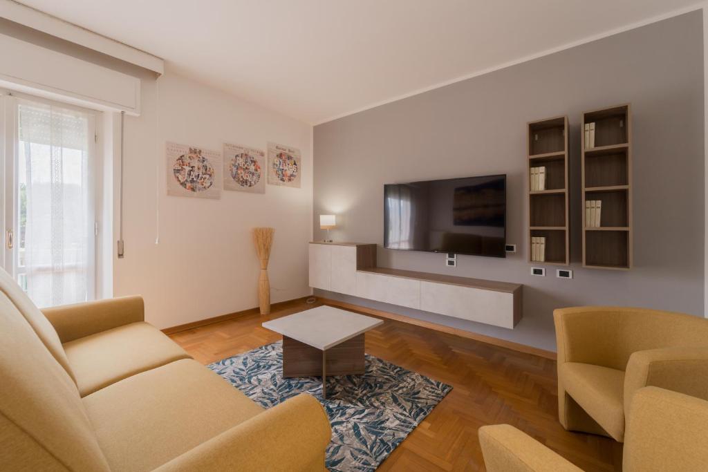 a living room with a flat screen tv on a wall at Angela Suite in Portoferraio