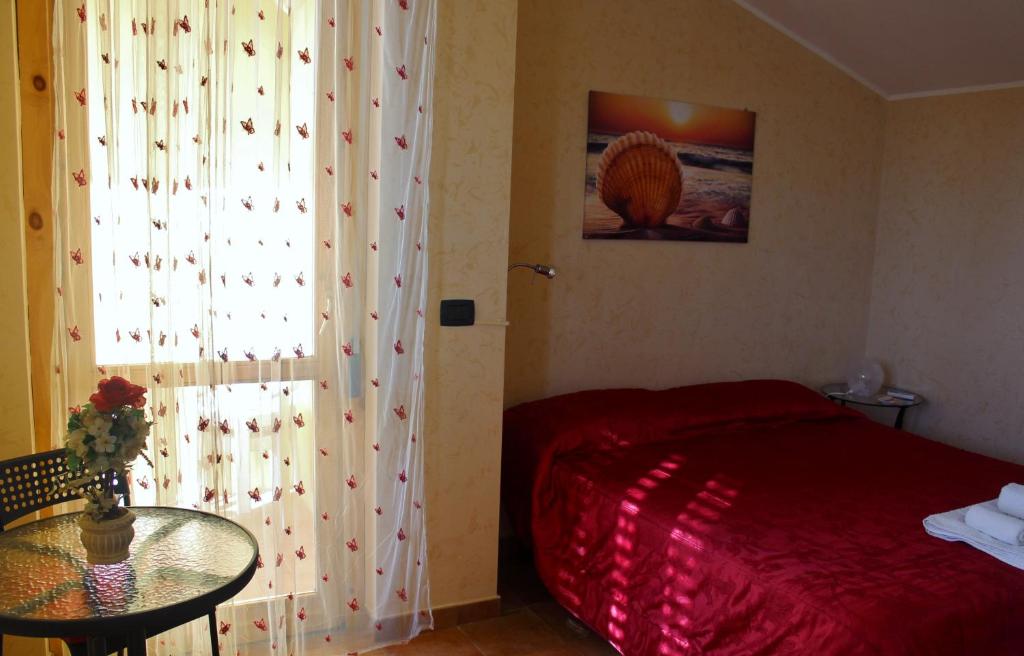 Łóżko lub łóżka w pokoju w obiekcie Colle Sul Mare