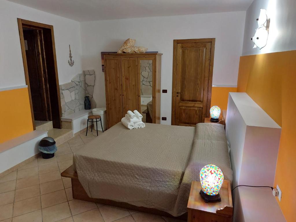 Postel nebo postele na pokoji v ubytování B&B Albachiara