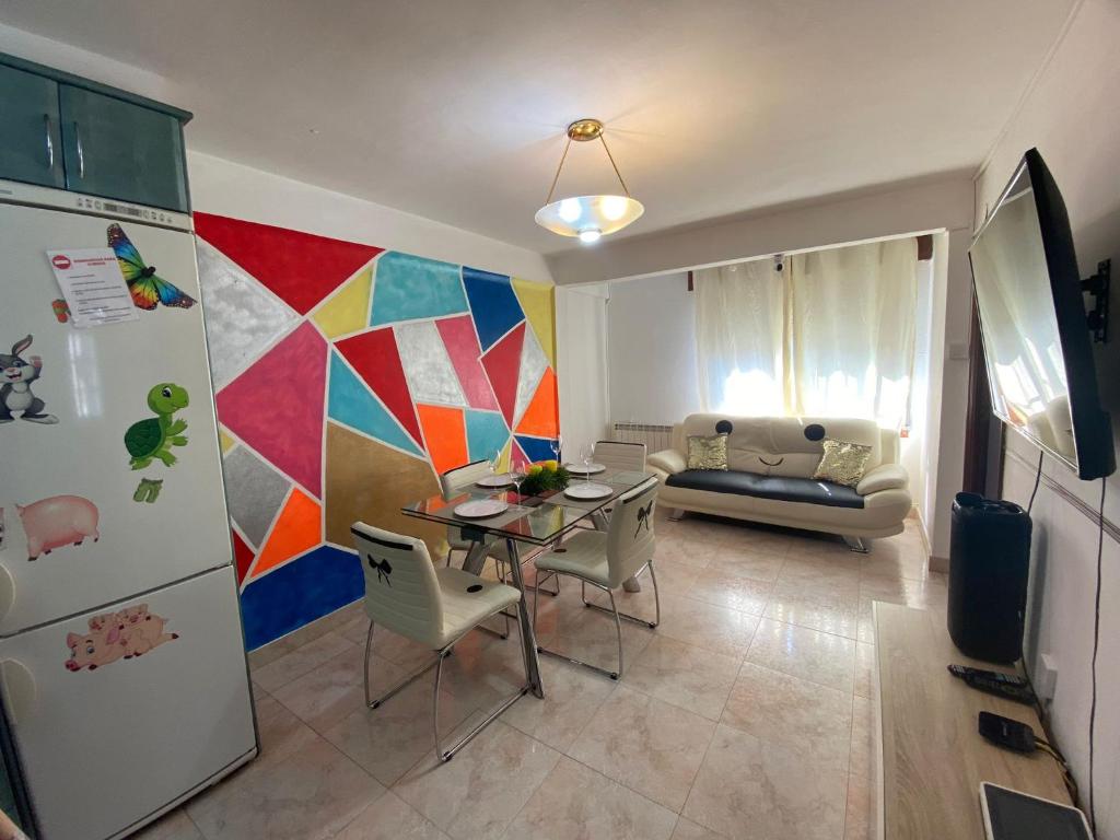 Televízia a/alebo spoločenská miestnosť v ubytovaní APT para Amigos y Familias