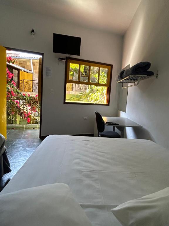 Postel nebo postele na pokoji v ubytování Hotel dos Sonhos