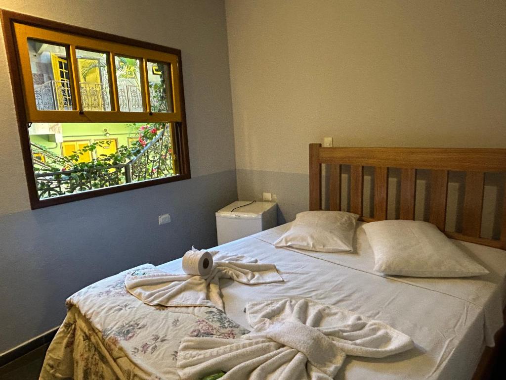Postel nebo postele na pokoji v ubytování Hotel dos Sonhos