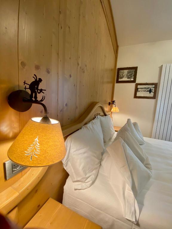Postel nebo postele na pokoji v ubytování Rutzer Hotel Ristorante & Panoramic SPA