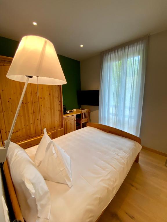 Postel nebo postele na pokoji v ubytování Rutzer Hotel Ristorante & Panoramic SPA