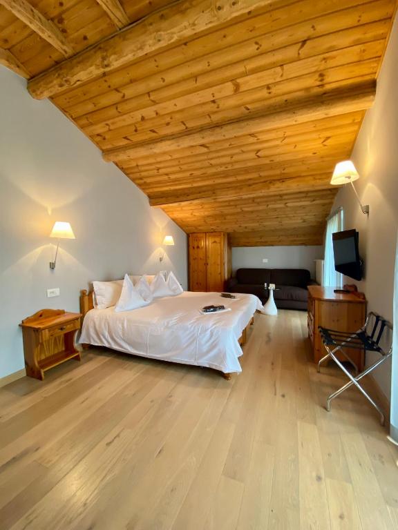 Postel nebo postele na pokoji v ubytování Rutzer Hotel Ristorante & Panoramic SPA