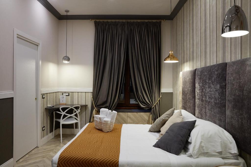 Postel nebo postele na pokoji v ubytování Hotel Roma Vaticano