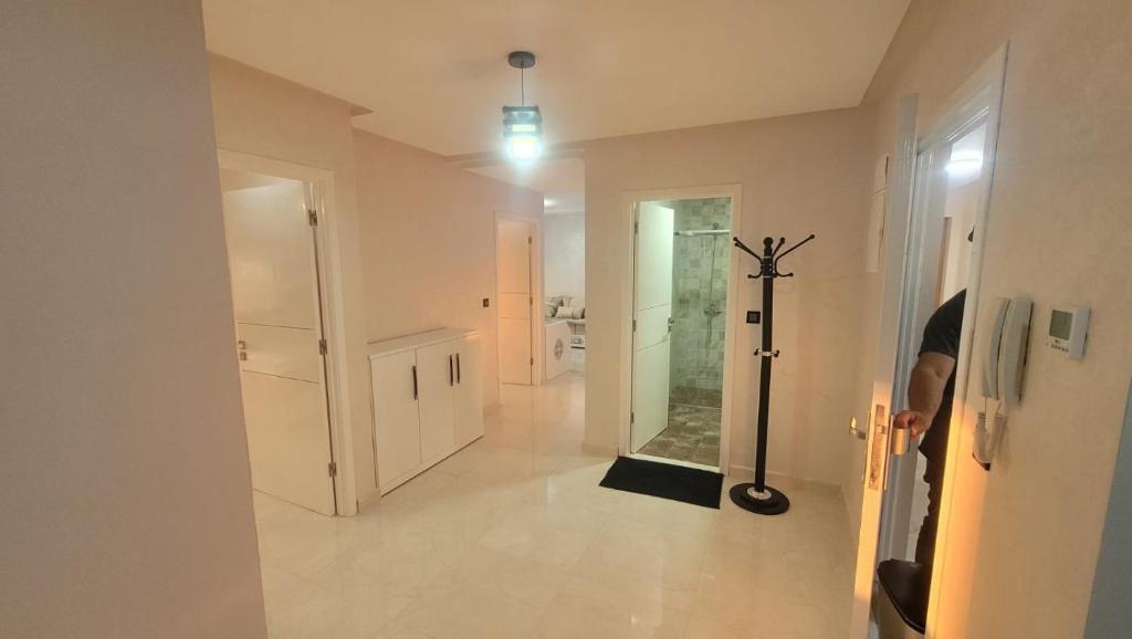 a room with a hallway with a mirror and a vacuum at Nador Jadid Hay AL Matar 10 6 in Nador
