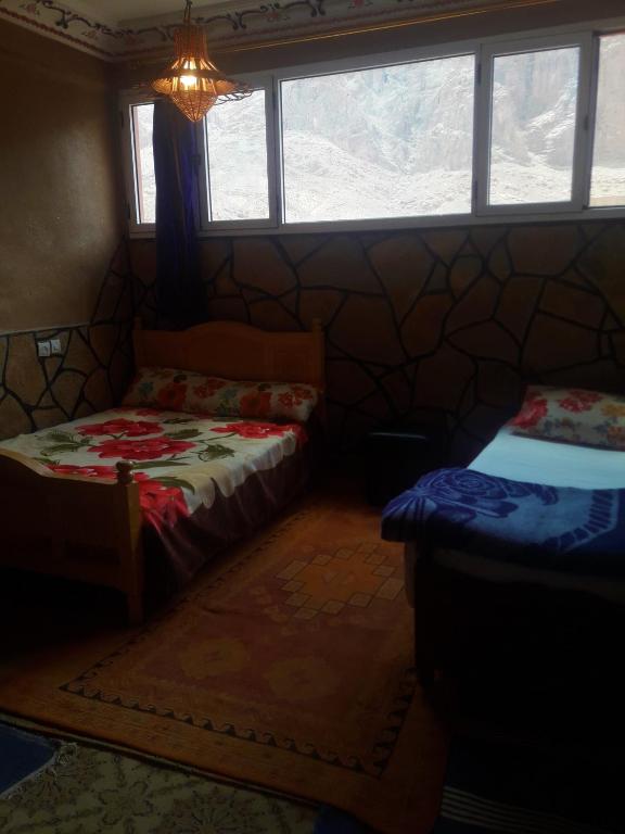 Postel nebo postele na pokoji v ubytování Dounia Hostel