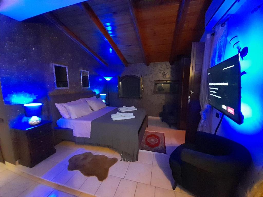 TV a/nebo společenská místnost v ubytování Luxury b&b Le Rocce