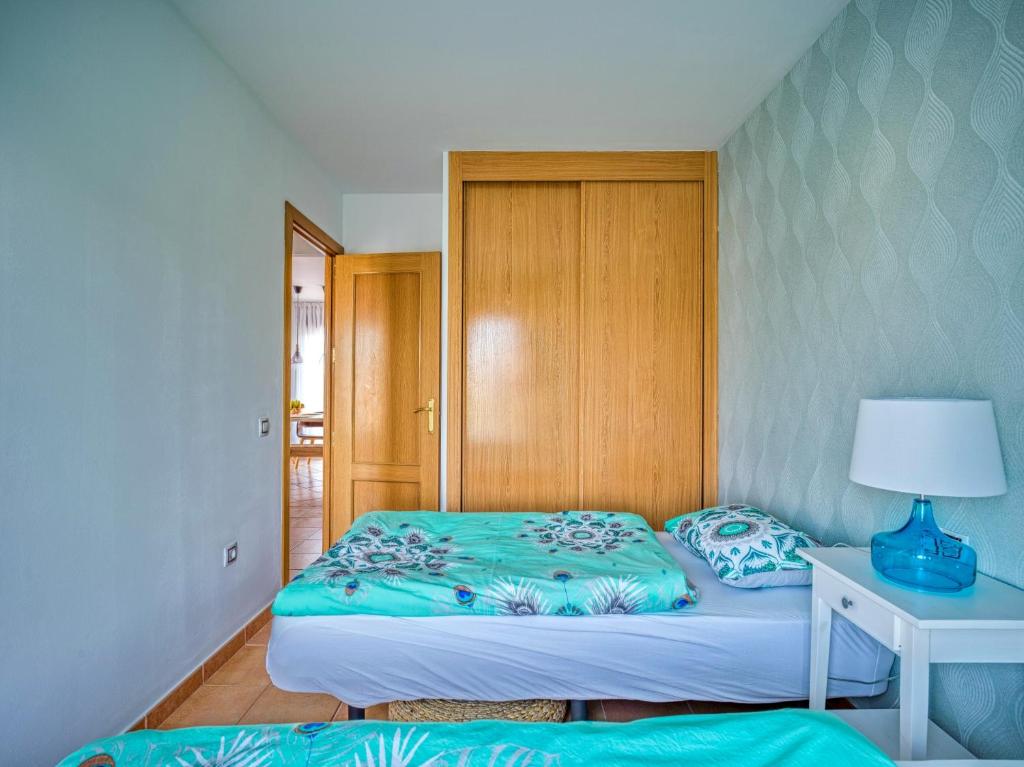A bed or beds in a room at Villa Origo Mare 1236 in Majanicho