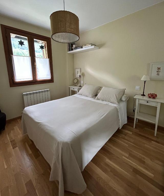 Postel nebo postele na pokoji v ubytování Sallent de Gállego - Formigal - Pirineos Sur