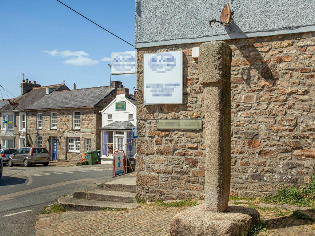 a stone building on the side of a street at Upper Deck in Saint Erth