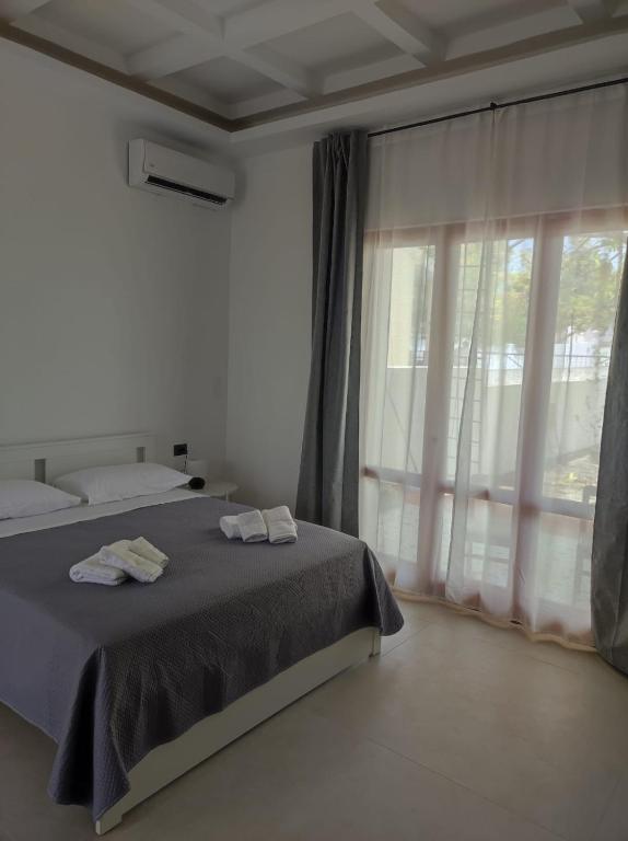 Postel nebo postele na pokoji v ubytování Villa Rita Apartament & Rooms
