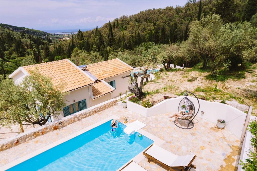 an aerial view of a villa with a swimming pool at Meliades villas in Apolpaina