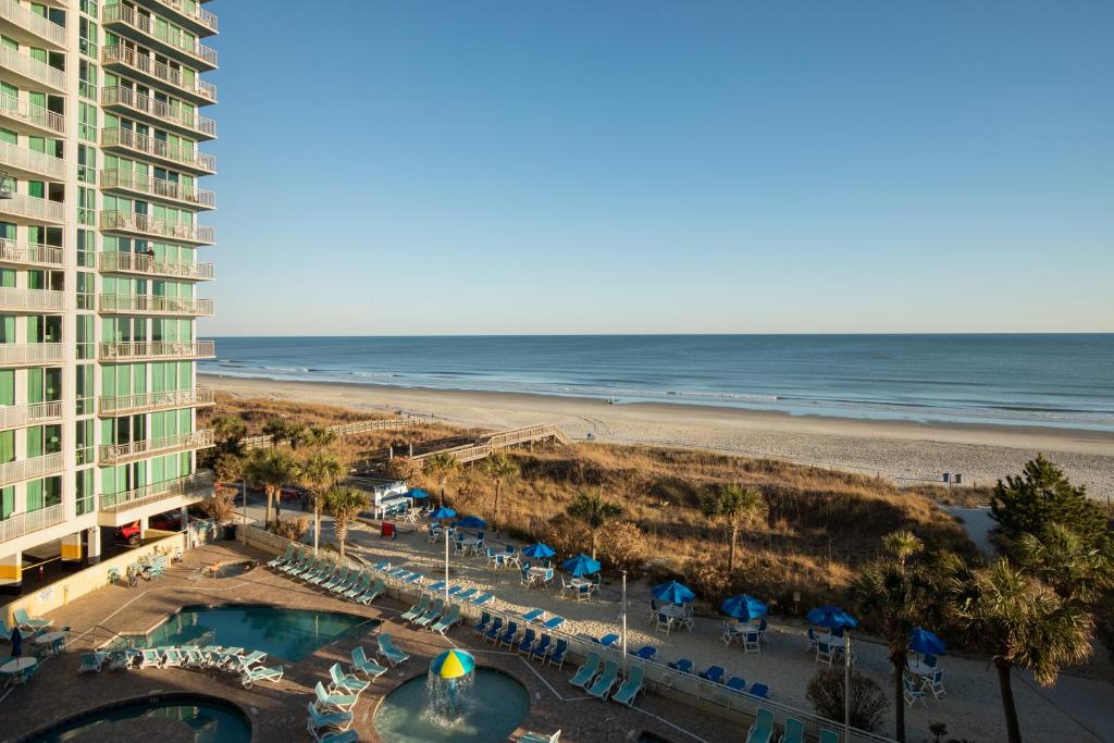 a view of the beach from the balcony of a resort at Avista Resort in Myrtle Beach