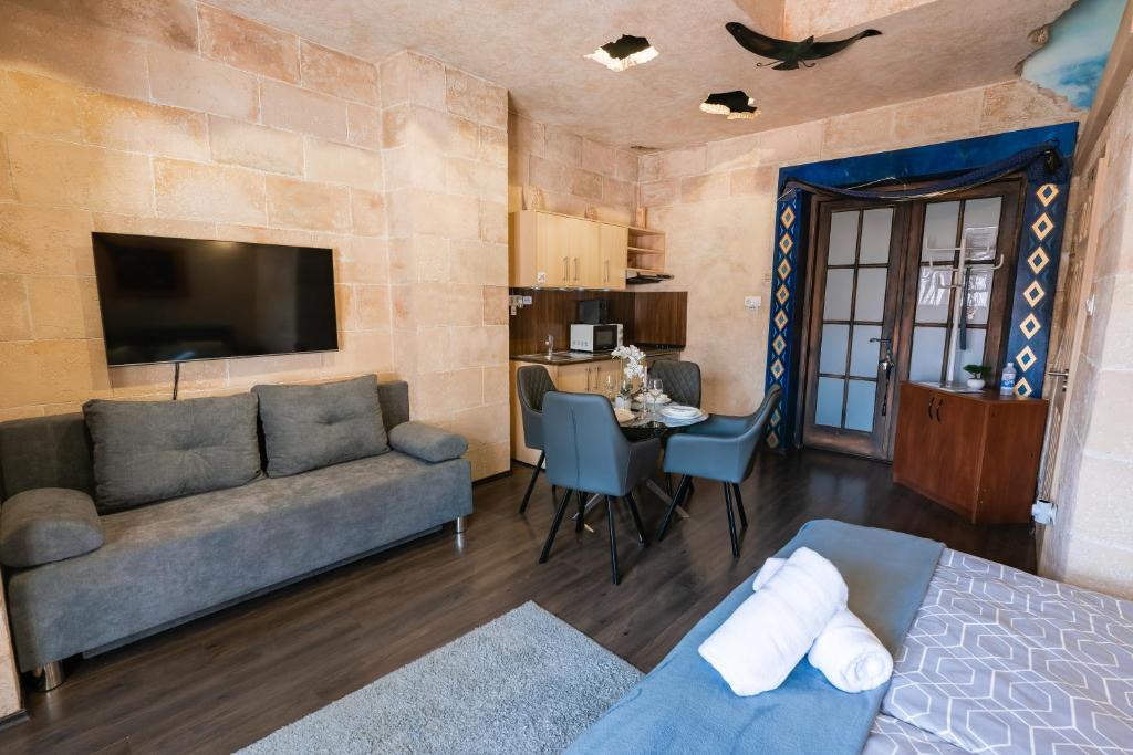 Telewizja i/lub zestaw kina domowego w obiekcie Weissmann Residence