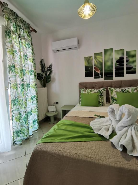 Posteľ alebo postele v izbe v ubytovaní Evris House oasis