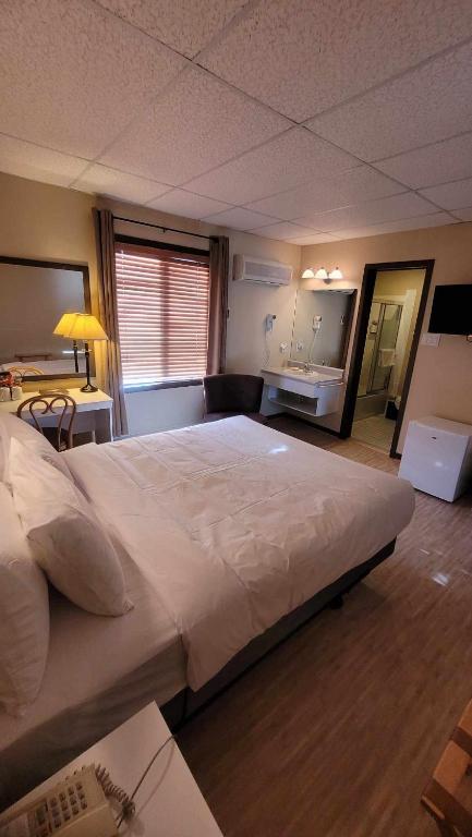 Postel nebo postele na pokoji v ubytování Hôtel Aquamer