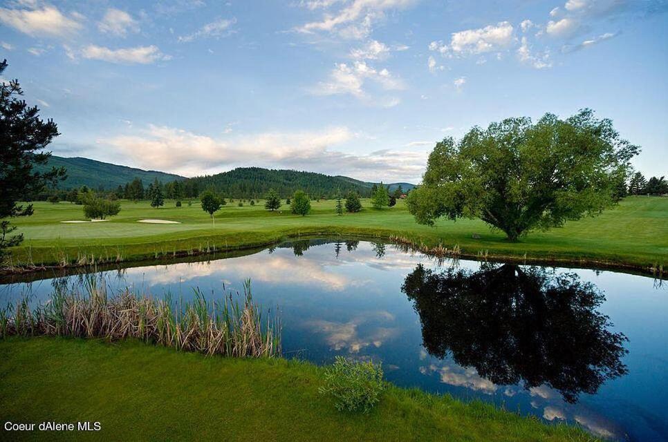 a view of a golf course with a pond at Stoneridge Resort in Blanchard