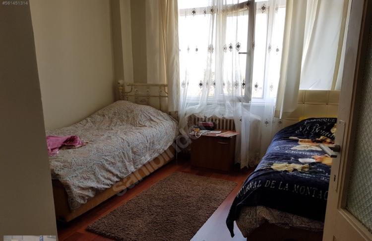a small bedroom with a bed and a window at Bostanci cozy excellent location flat in Istanbul